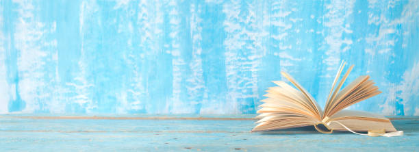 istock open book on blue grungy background, good copy space 1056739062