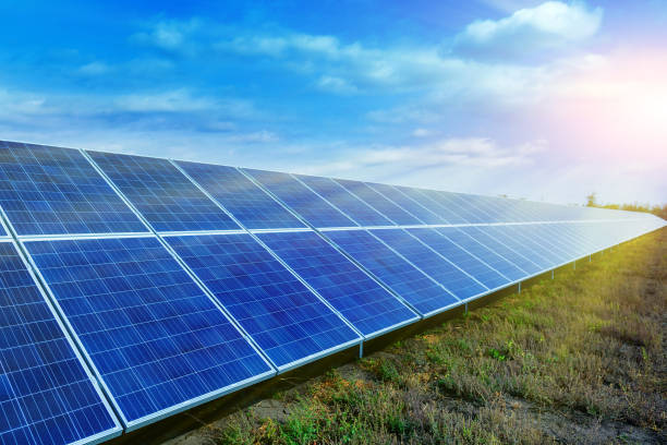 istock Solar panels, photovoltaic, alternative source environmentally friendly energy. In the backlight sunbeam light. 1056739440