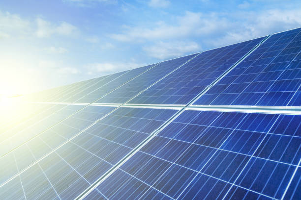 istock Solar panels, alternative source environmentally friendly energy. In the backlight sunbeam light. 1056739606