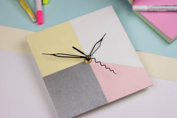 istock Creative bright top view with wall clock on the pink and blue background. Flat lay 1056740268