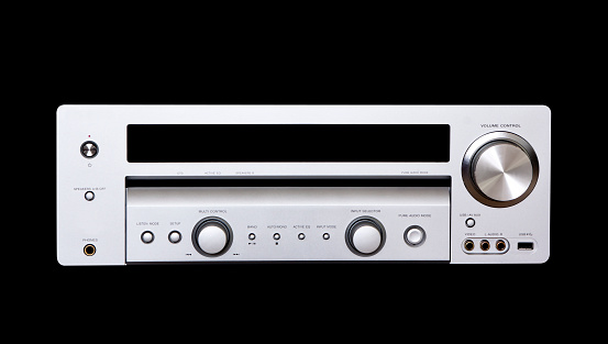 Front view of silver digital audio system, isolated on black background with clipping path, full frame horizontal composition