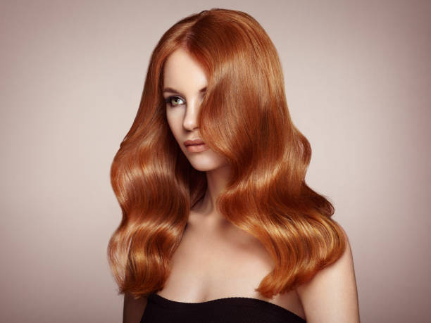 istock Redhead woman with curly hair 1056748374
