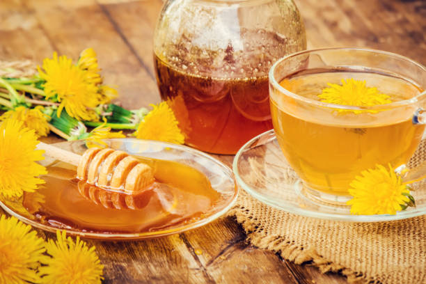 istock Honey from dandelion and a Cup of tea. Selective focus. 1056748720