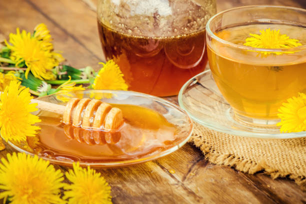 istock Honey from dandelion and a Cup of tea. Selective focus. 1056748754
