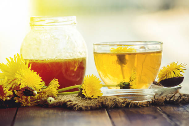 istock Honey from dandelion and a Cup of tea. Selective focus. 1056748926