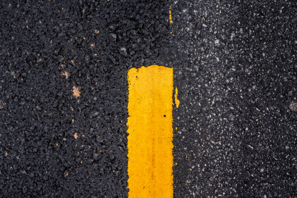 istock Asphalt road surface with yellow line 1056751700