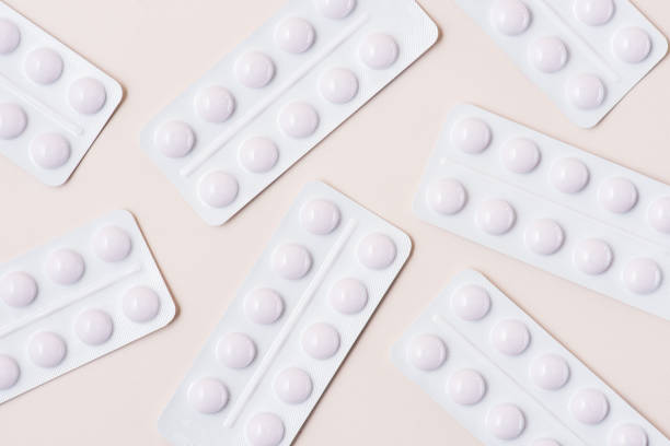 istock top view of white blisters with pills on beige 1056760552