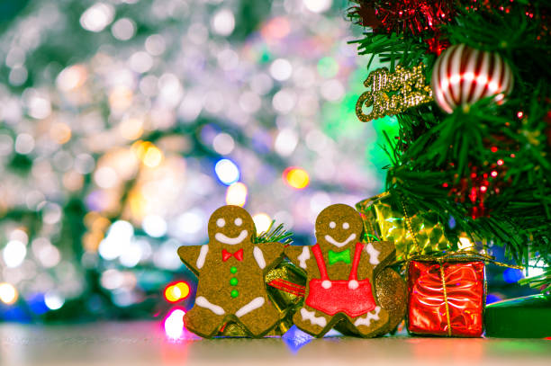istock Cute gingerbread man with christmas tree and blurry sparkle background, close up, bokeh, text space(copy space) 1056763066