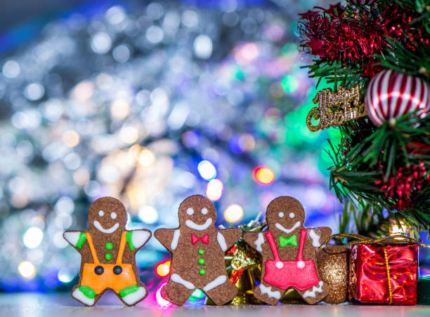 istock Cute gingerbread man with christmas tree and blurry sparkle background, close up, bokeh, text space(copy space) 1056763126