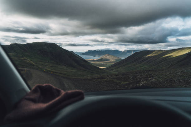Young Caucasian man driving car in Iceland