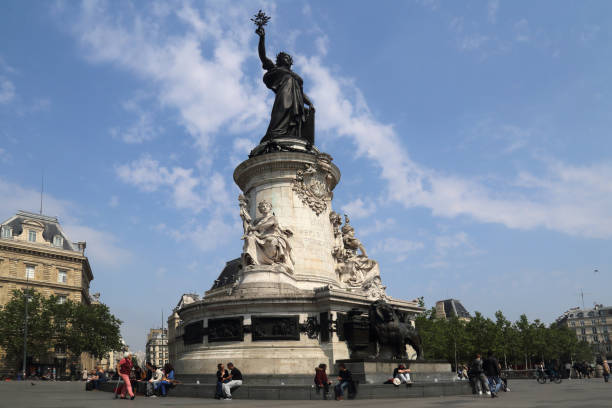People sitting at the monument on Place de la Republique in Paris, France on May 15, 2018