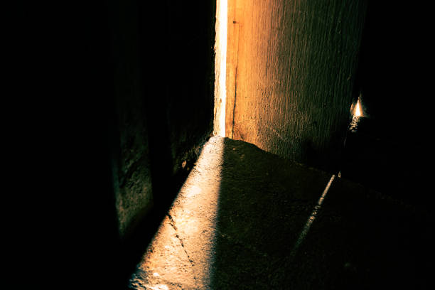 Light is shining through the entrance of a church