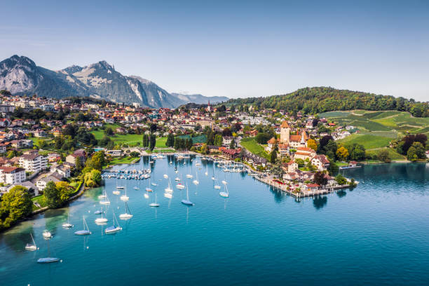 Spiez castle by lake Thun in Canton of Bern, Switzerland high angle view from drone point of Spiez town switzerland photos stock pictures, royalty-free photos & images