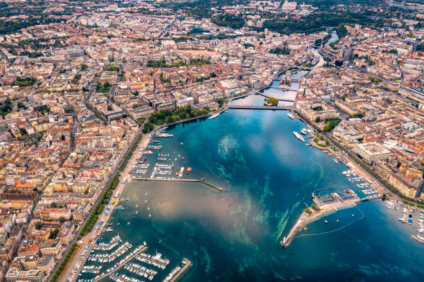 aerial view of Geneva city high angle view of Geneva city panoramic from drone point at morning with the Geneva Lake reflection of the sky. geneva switzerland photos stock pictures, royalty-free photos & images
