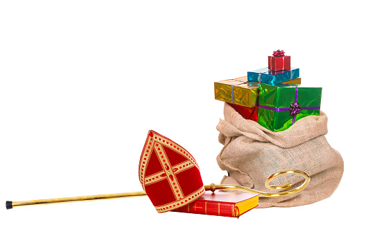 Mitre or miter sack with gifts and staff of saint nicholas. Isolated on white background. Sinterklaas border