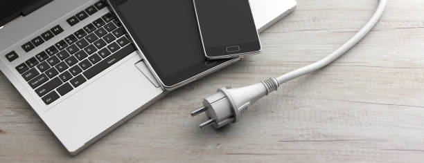 Computer, laptop, smartphone and power plug on wooden background. 3d illustration Electronic devices charging concept. Computer, laptop, smartphone and power plug on wooden background, banner. 3d illustration wooden flash drive stock pictures, royalty-free photos & images