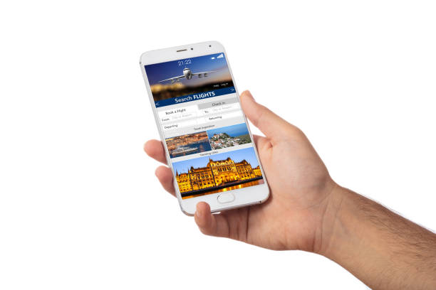 istock Hand holding a smartphone, search flights on the screen, isolated on white backgound. 1056780594