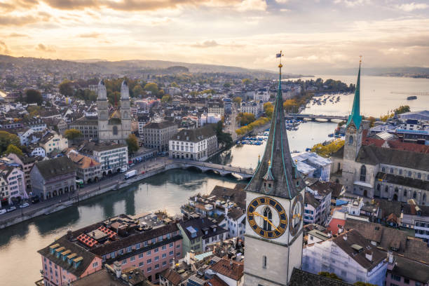 Zurich old town aerial view aerial view of St. Peter's Church clock tower, Fraumunster and Grossmunster by the Limmat River, Zurich old town at morning zurich photos stock pictures, royalty-free photos & images
