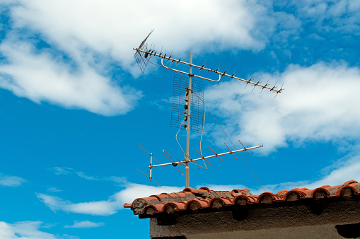 Old type antenna on the roof of house, Italy