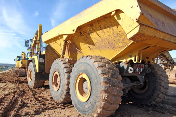 istock Large Dump Truck, Rear Quarter View 1056785084