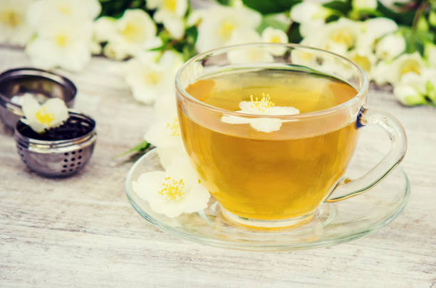 istock Cup of herbal tea with Jasmine flowers. selective focus. 1056785672