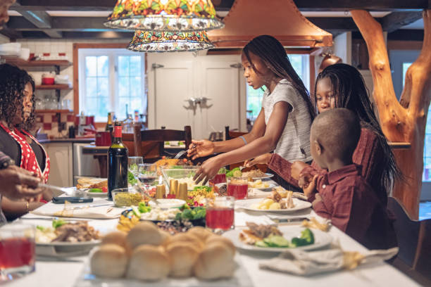 istock African-American during thanksgiving dinner 1056785870