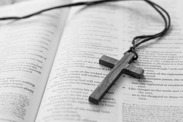 istock Bible and cross on wooden desk 1056794748