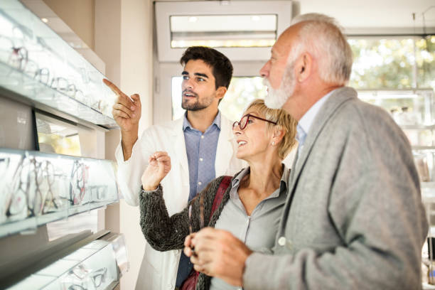 Senior couple shopping for eyeglasses