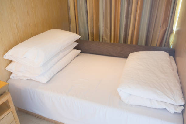 istock Small bedding area in hotel room. Apartment concept 1056798266