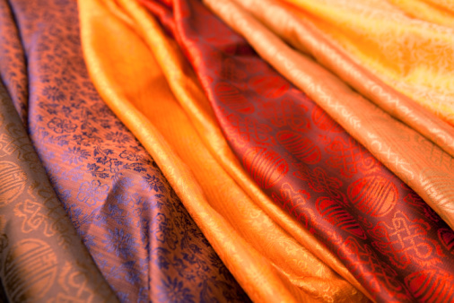 Silk scarves from India in a marketplace.