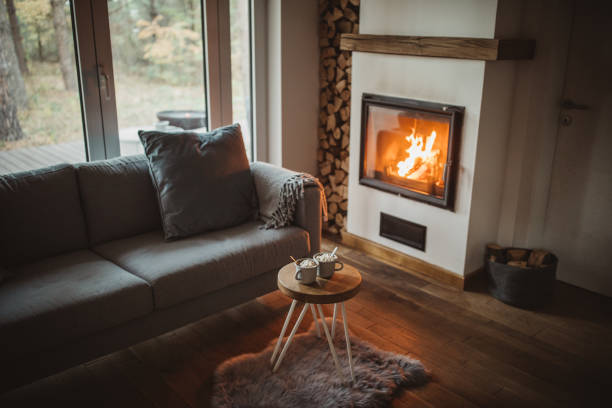 comfort van huis - fireplace stockfoto's en -beelden