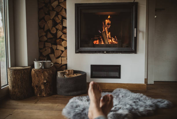Best way to spend winter day Woman feet near fireplace hot chocolate photos stock pictures, royalty-free photos & images