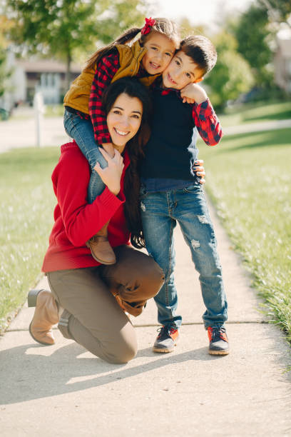 istock Beautiful mother with little kids 1056806614