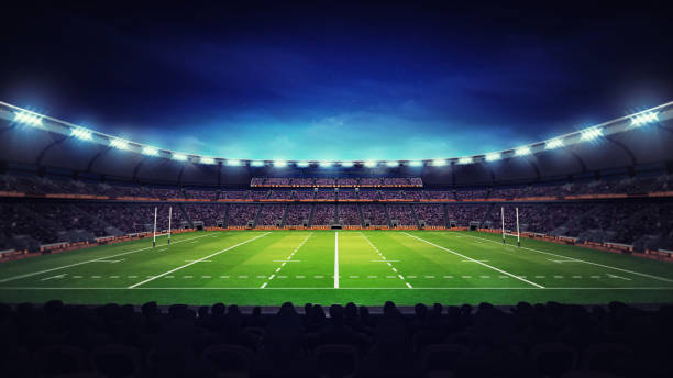 istock illuminated modern rugby stadium with spectators and green grass 1056806652