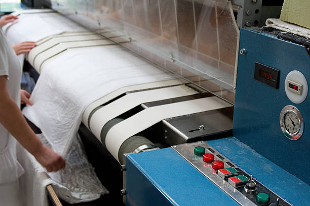 séchage rapide et de planche à roulettes à la presse - textile machinery photos et images de collection