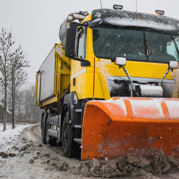 istock snowplow clearing road, winter service 1056810402