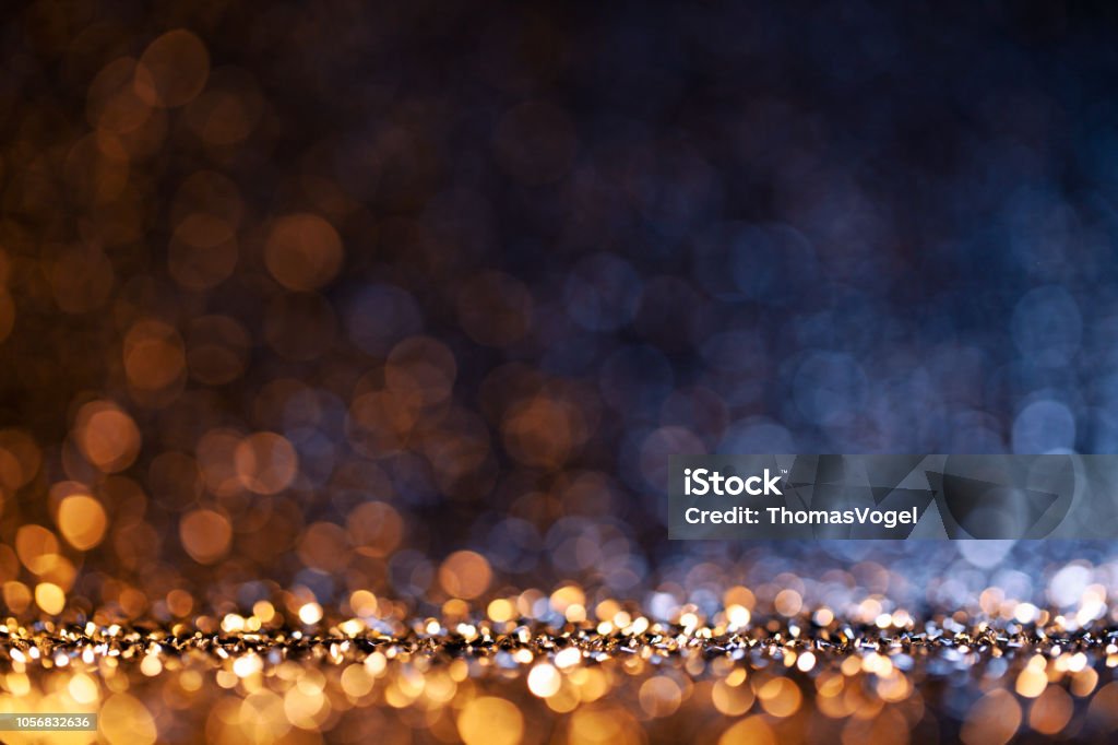 Christmas lights defocused background - Bokeh Gold Blue Photography of defocused yellow and blue lights. Christmas Stock Photo