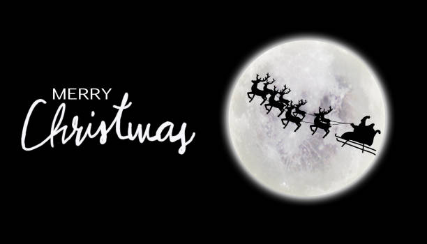 istock Santa riding sleigh with reindeers silhouette 1056832684