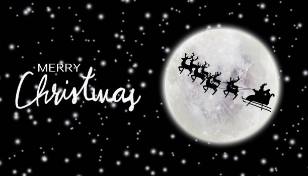 istock Santa riding sleigh with reindeers silhouette 1056832698