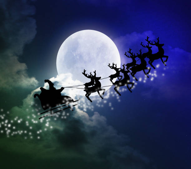 istock Santa riding sleigh with reindeers silhouette 1056832736