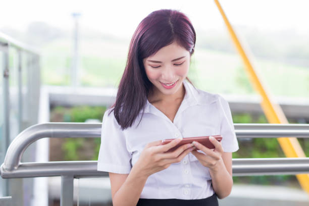 istock business woman play mobile game 1056832972