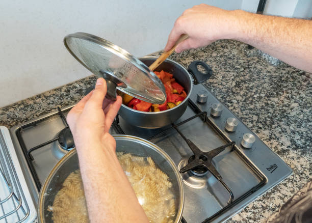 istock Pans and food on the stove 1056834376