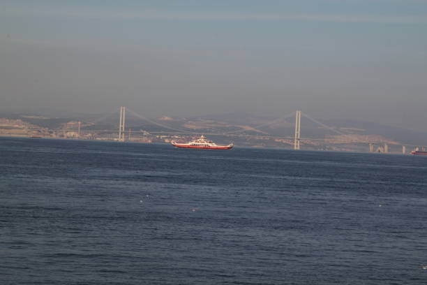 istock Osman Gazi Bridge and  ferry 1056834808