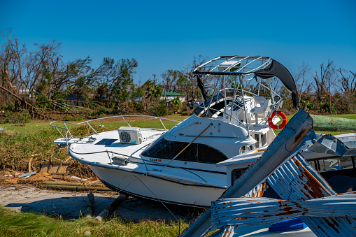 Boat on land after hurricane Michael Watson Bayou in Panama City, Florida