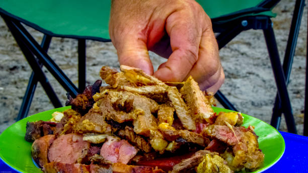 delicious barbecue on the beach with meat, sausage and chicken