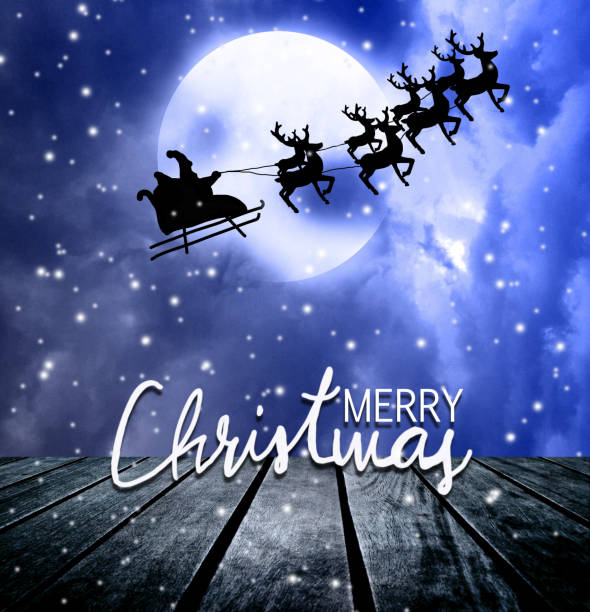 istock Santa riding sleigh with reindeers silhouette 1056838868
