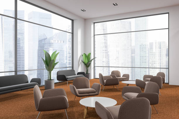 istock Brown armchairs loft office waiting room interior 1056846326
