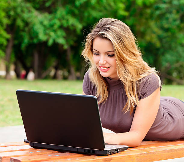 istock Young pretty woman with laptop 105684698