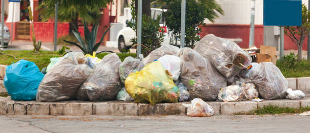 istock Waste bags in the street on the sidewalks 1056847068