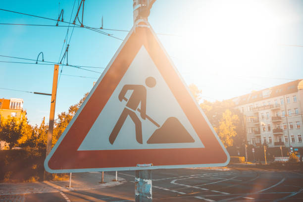 istock triangle building site traffic sign in warm sunlight at berlin, germany 1056847612